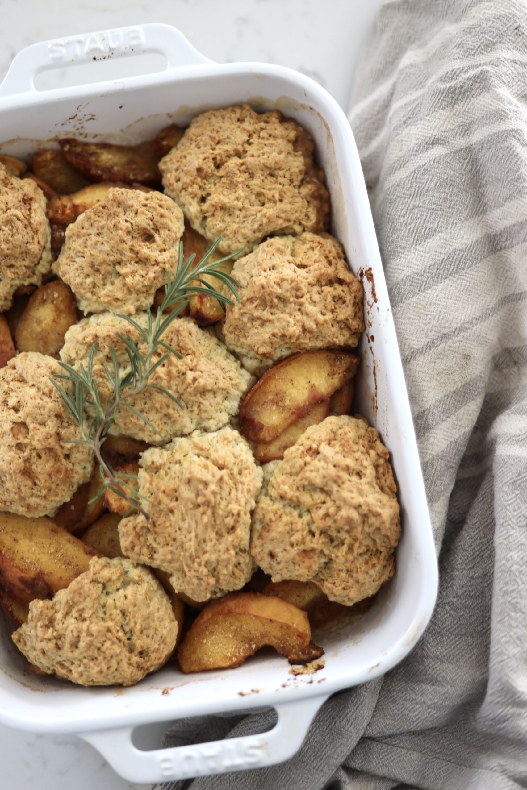 An up-close image of peach cobbler with sourdough, a sourdough discard cobbler 