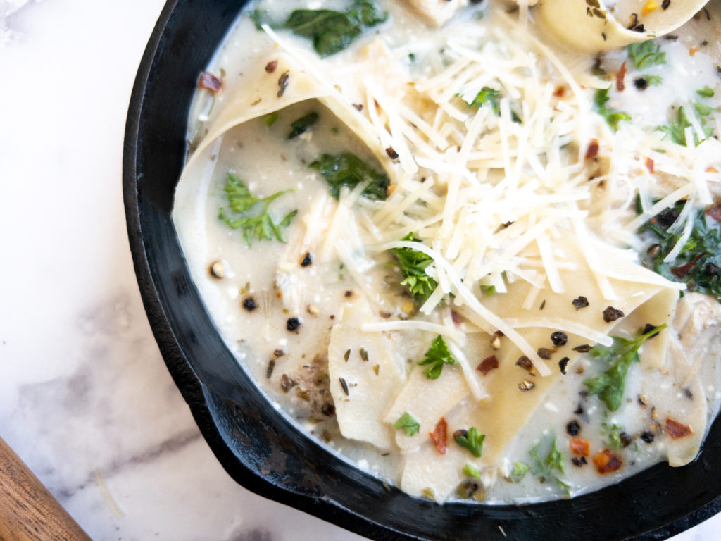 An up close view of white lasagna soup