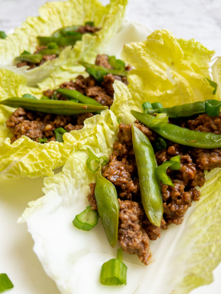 Ground beef and sugar snap peas up close