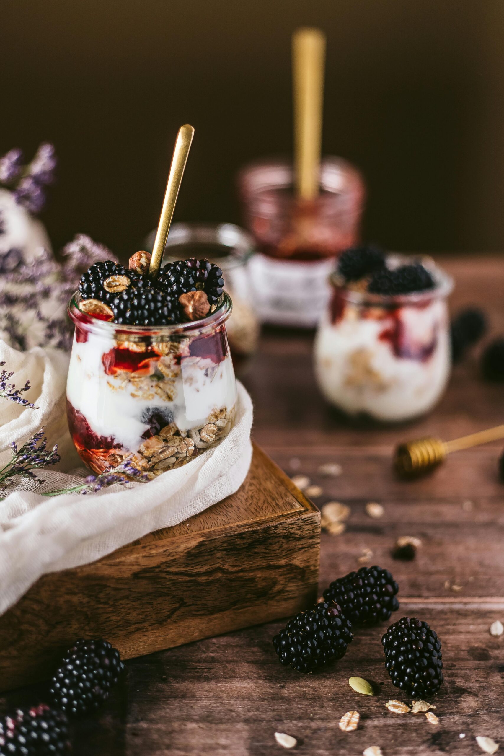 Milk kefir made with kefir grains in a cup with berries and granola