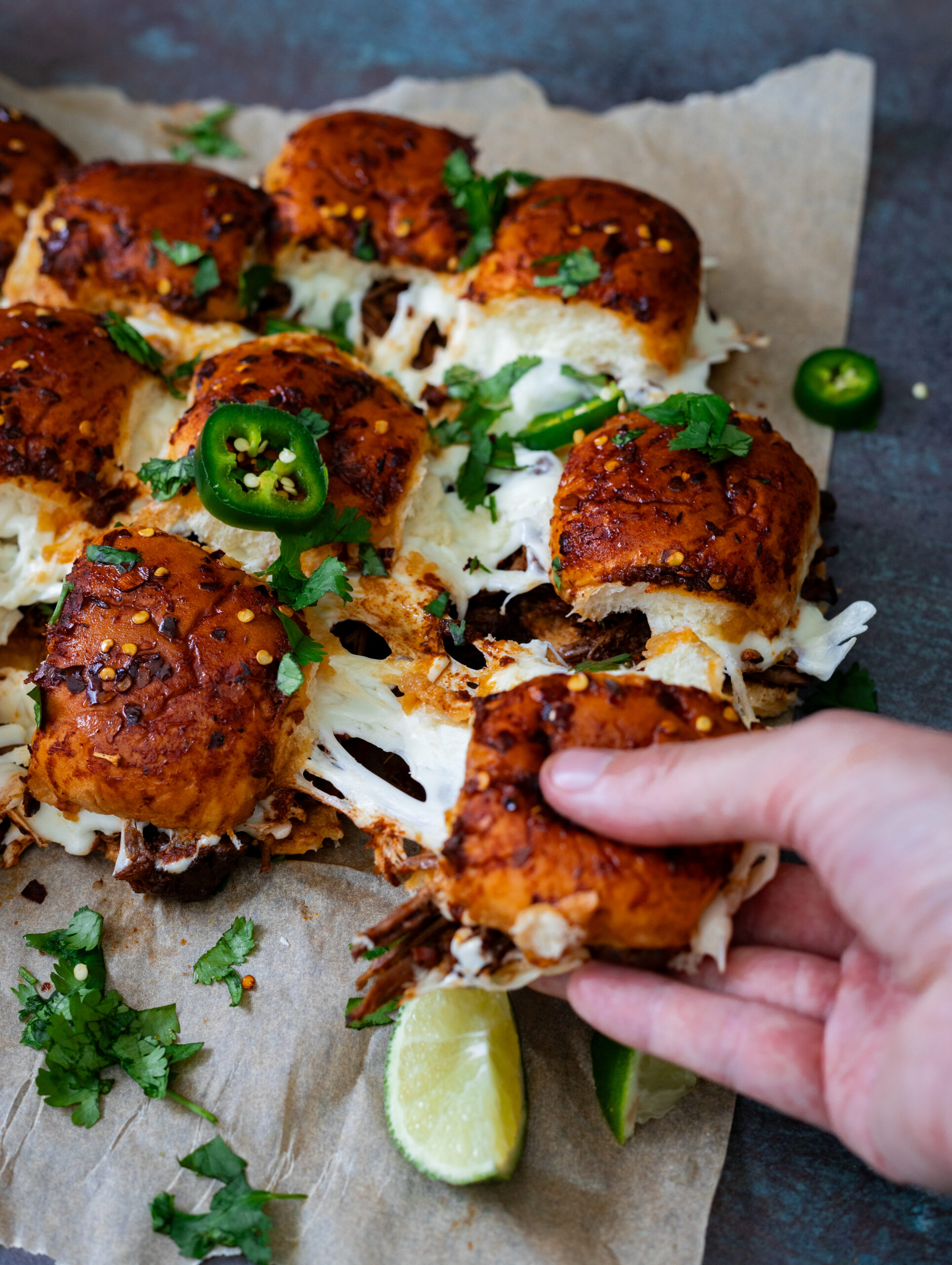 quesabirria sliders with stretchy oaxaca cheese