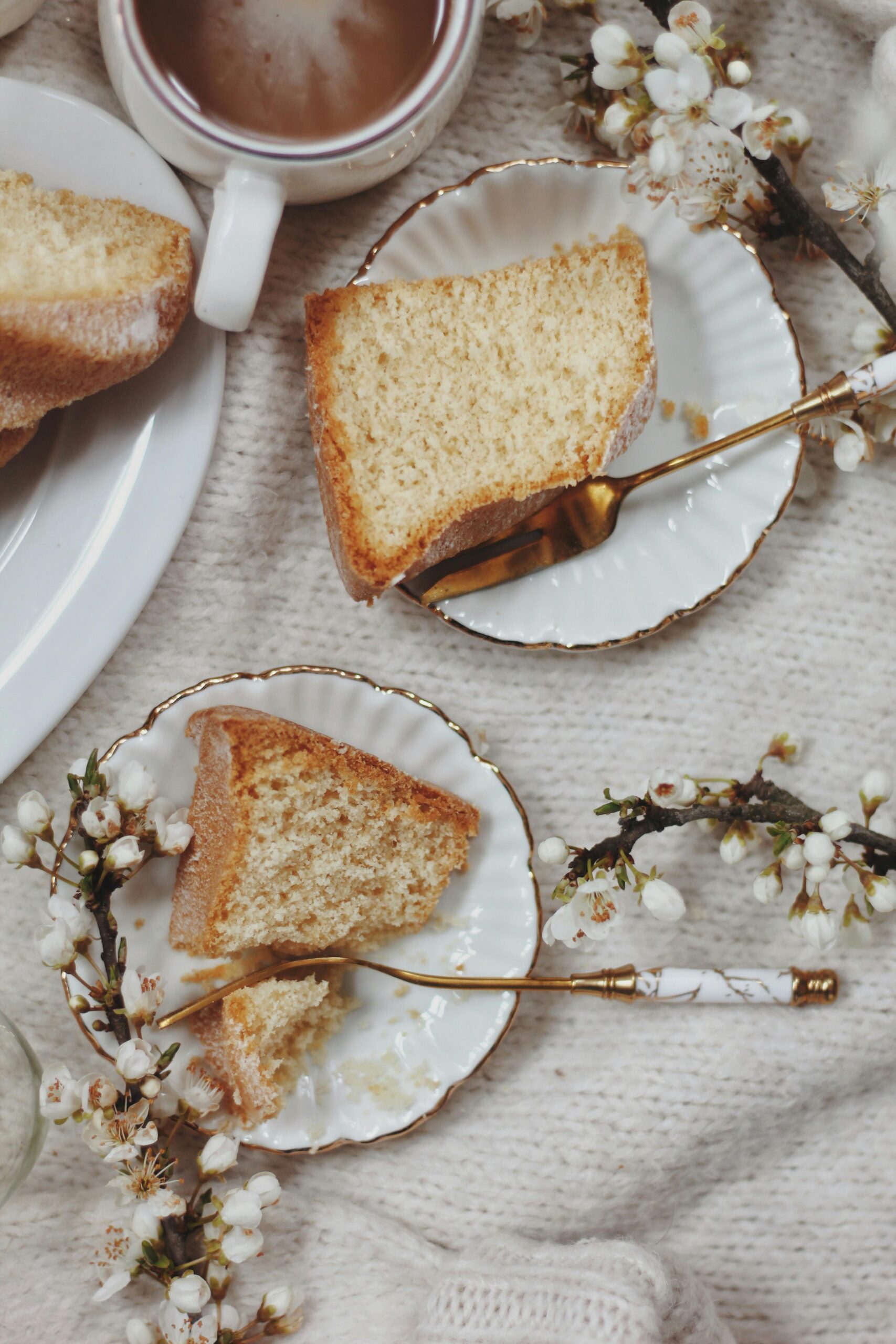 Slices of a rustic tea cake on fine china