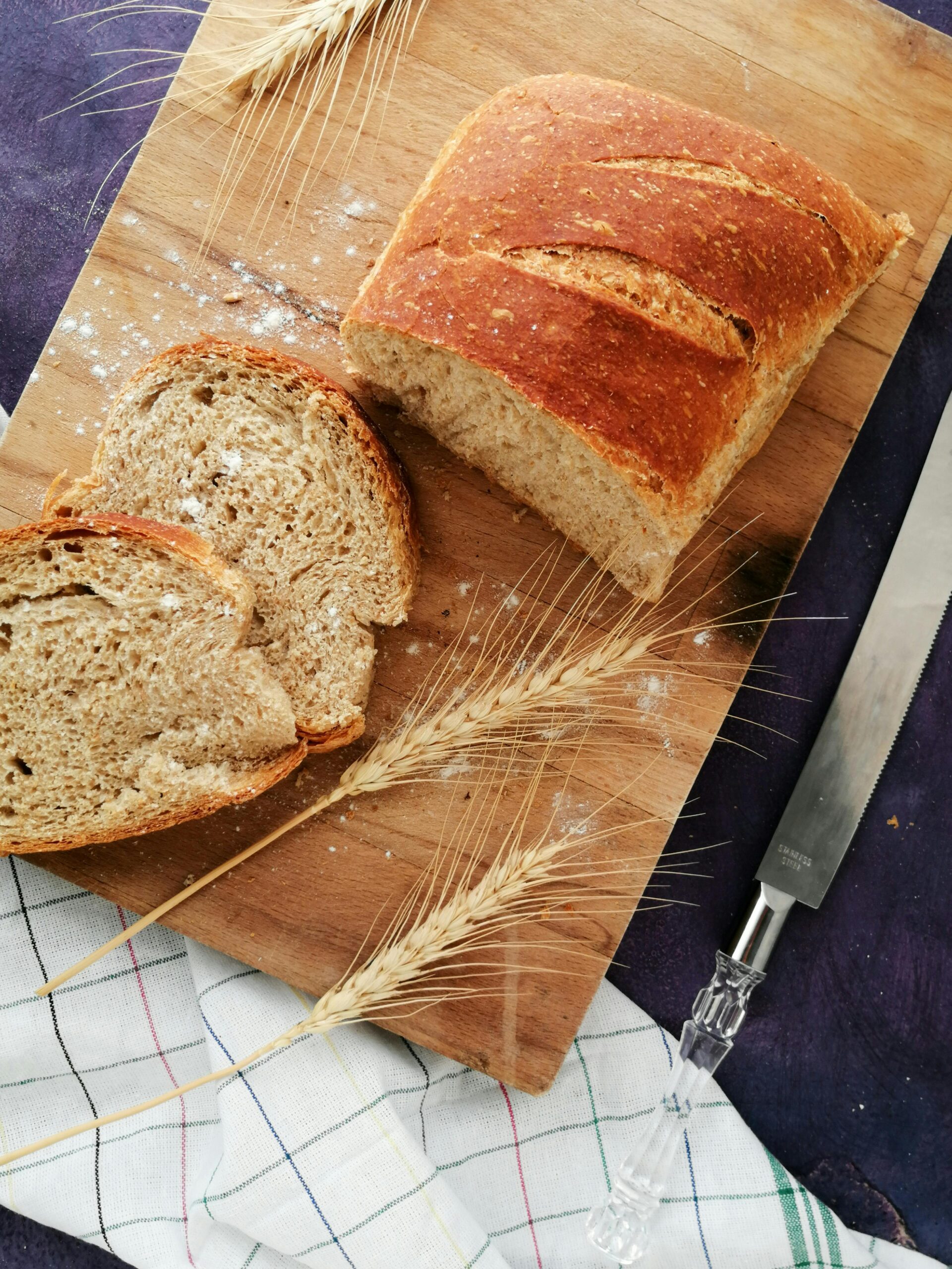 An overhead image of sliced fresh milled bread, a whole wheat sourdough bread recipe