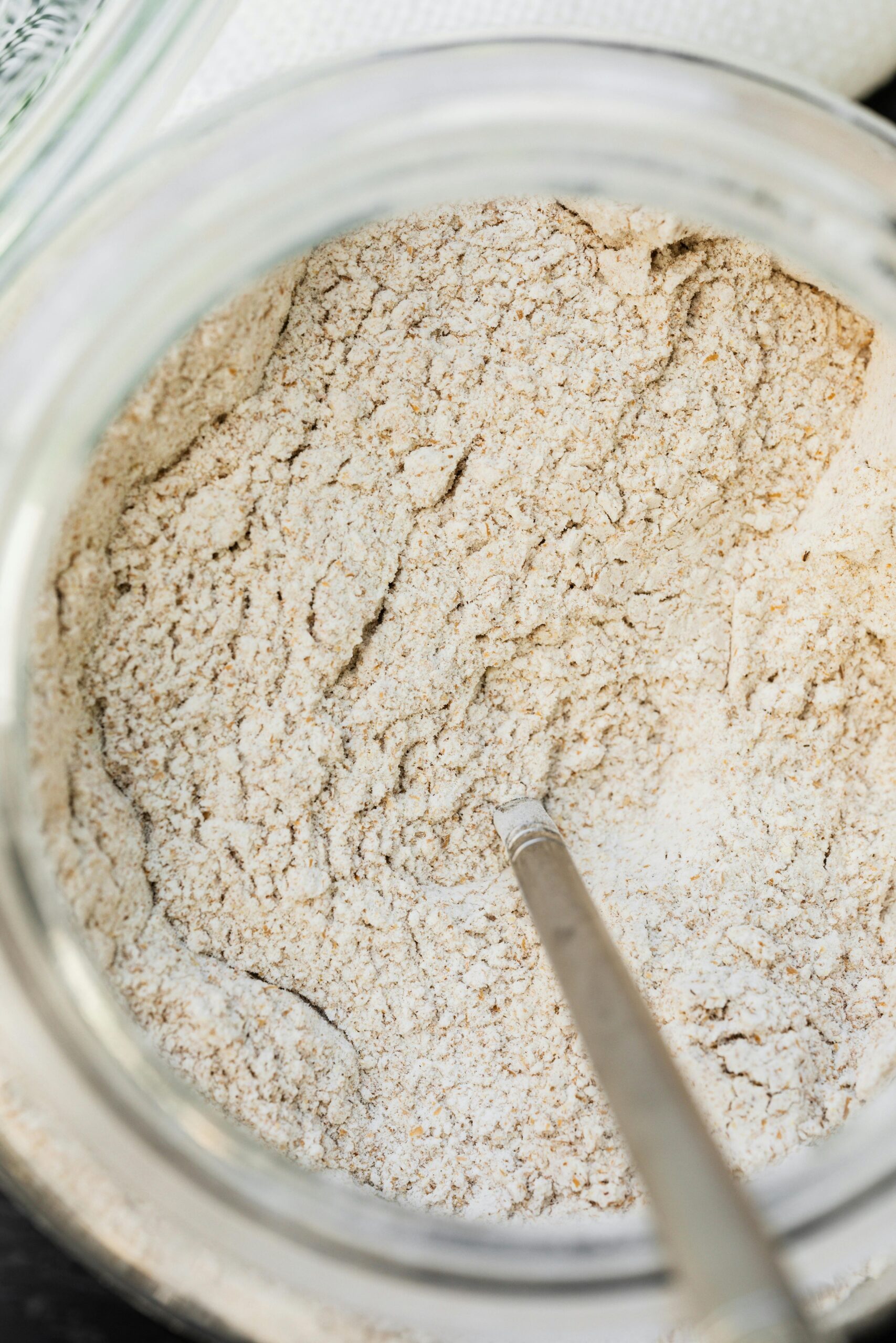 A jar of fresh milled flour showing baking with fresh milled flour and whole grain baking tips
