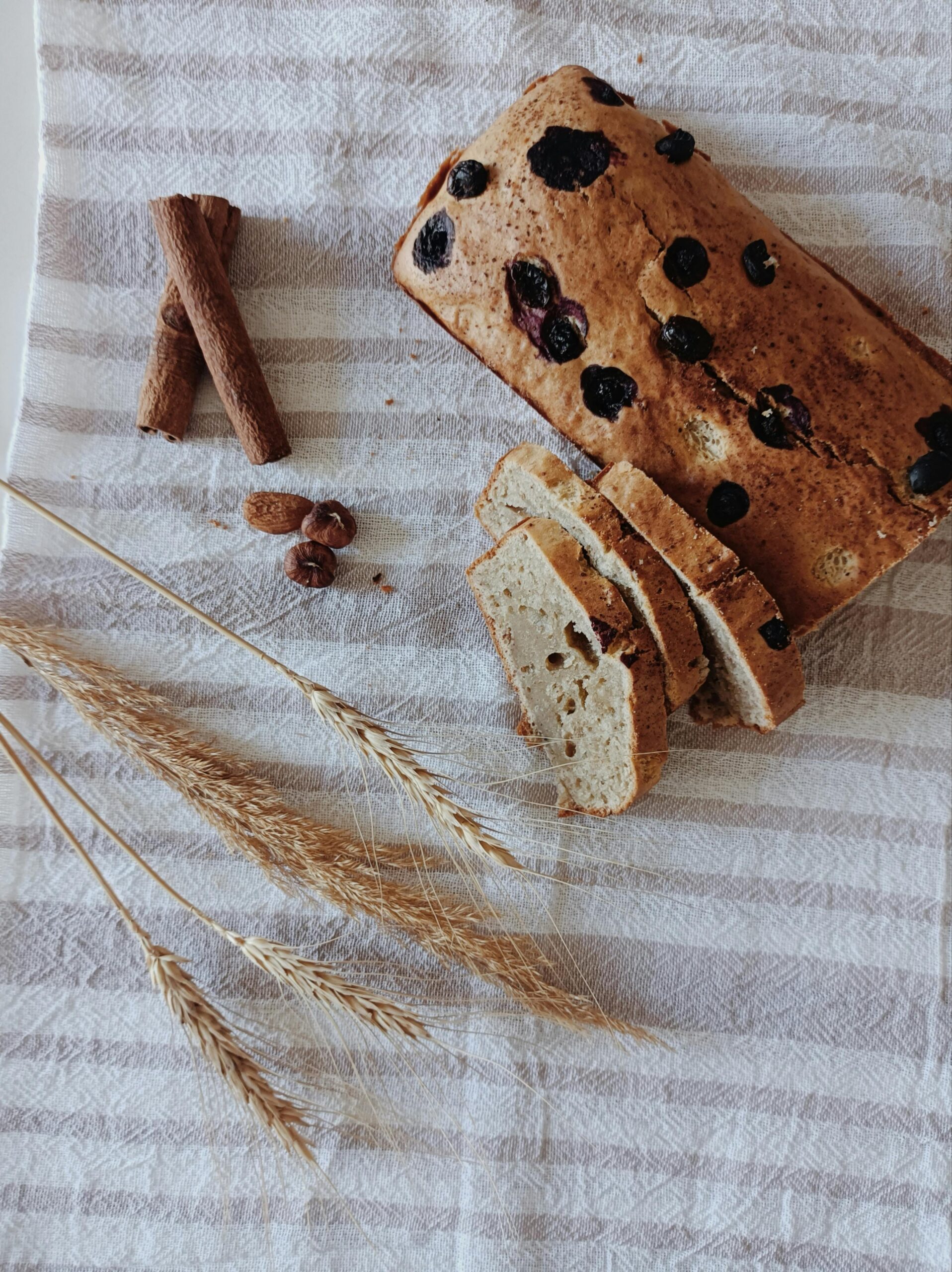 A sliced loaf of sourdough cinnamon swirl bread, a sourdough raisin bread recipe 