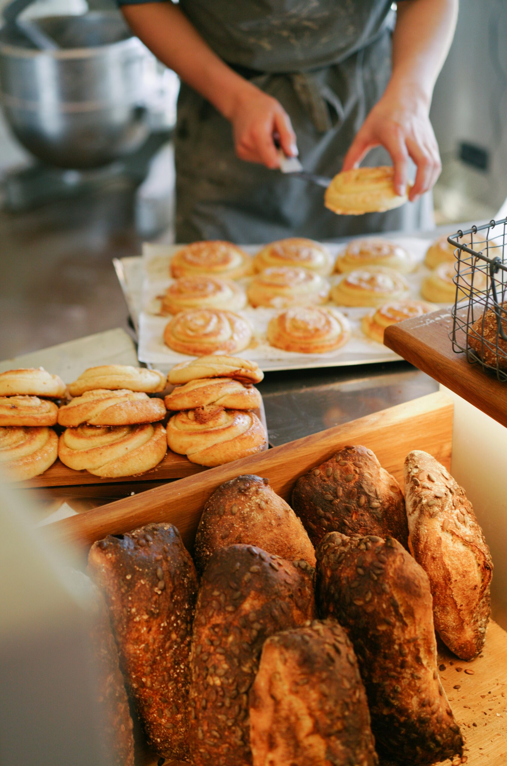 A baker preparing baked goods which are homestead side hustles that actually work and show how to make money homesteading