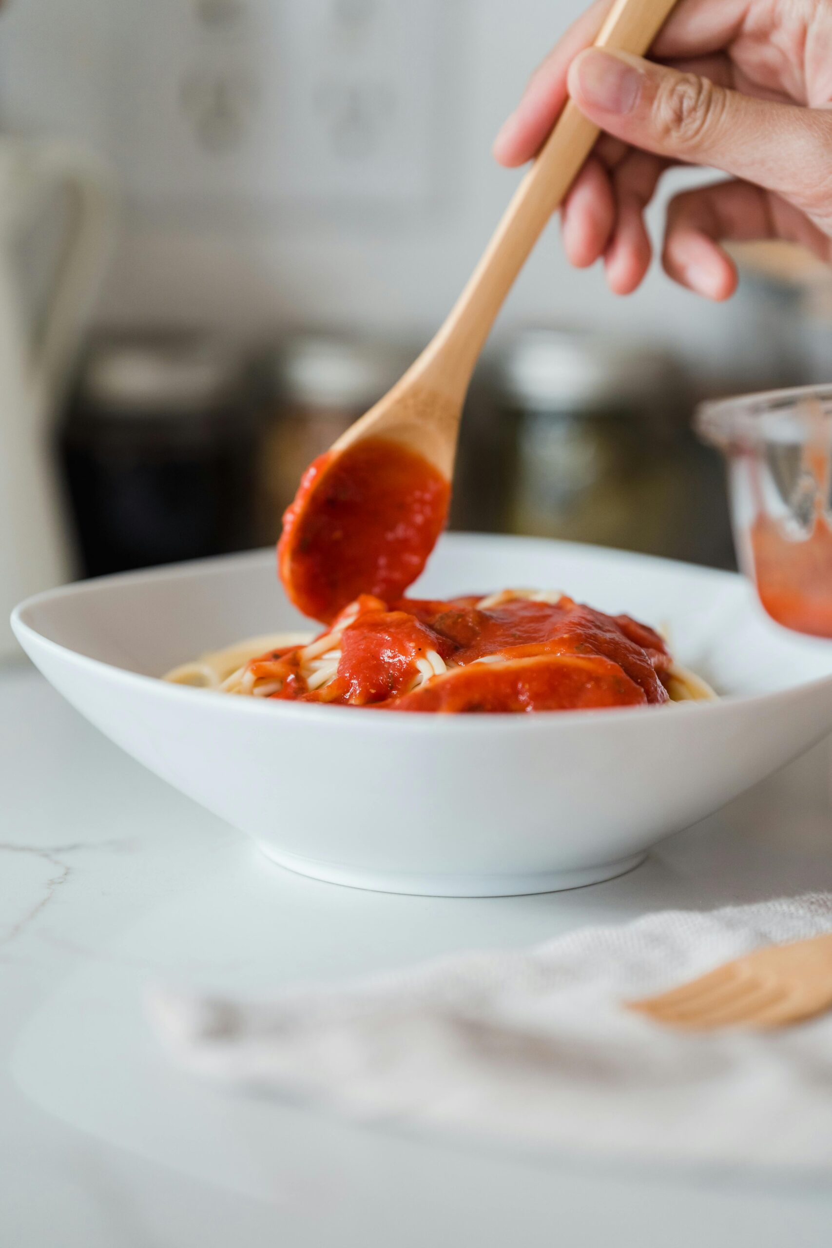 Homemade canned tomato sauce on spaghetti, a safe tomato sauce canning recipe