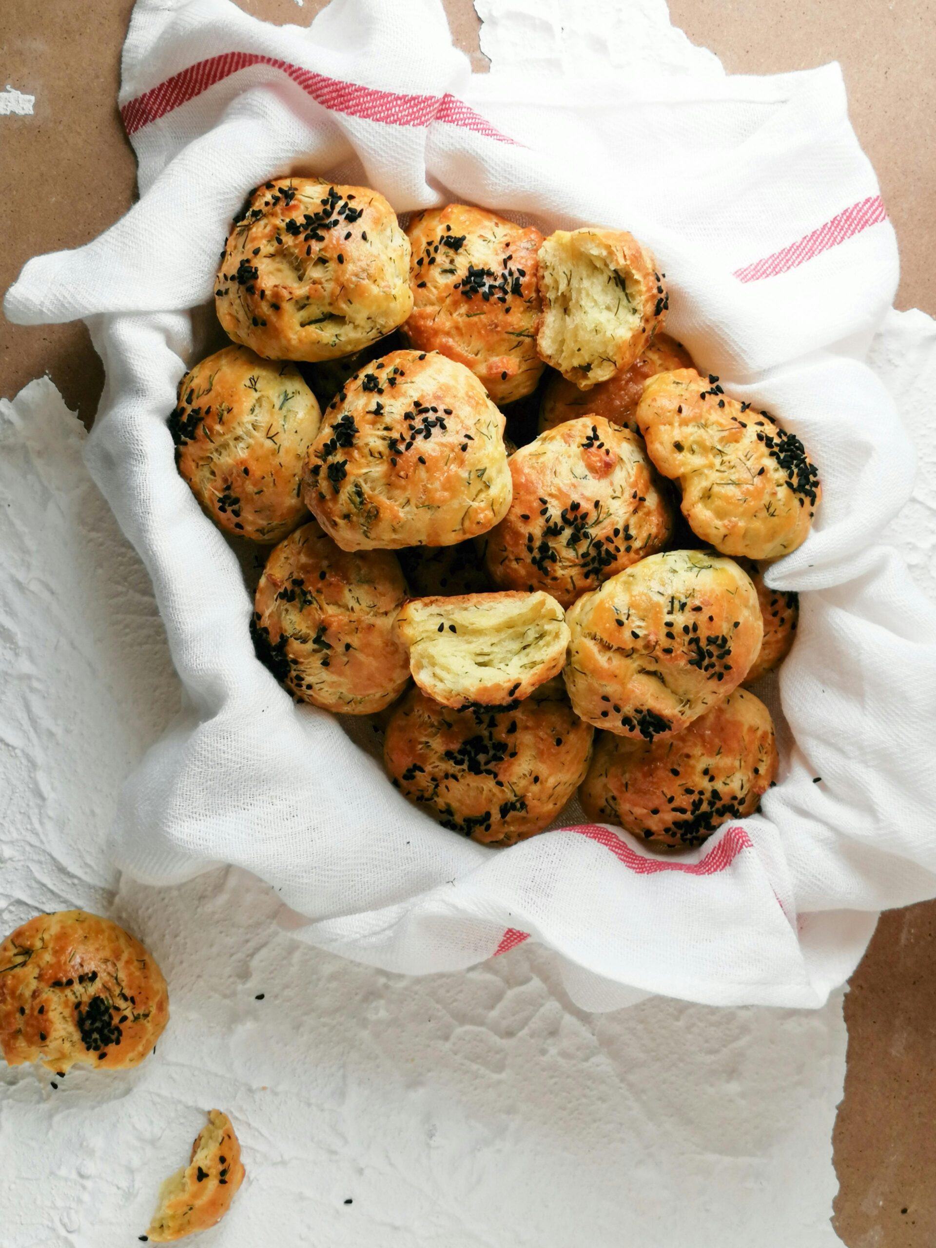 sourdough biscuits in a basket that are flaky sourdough biscuits