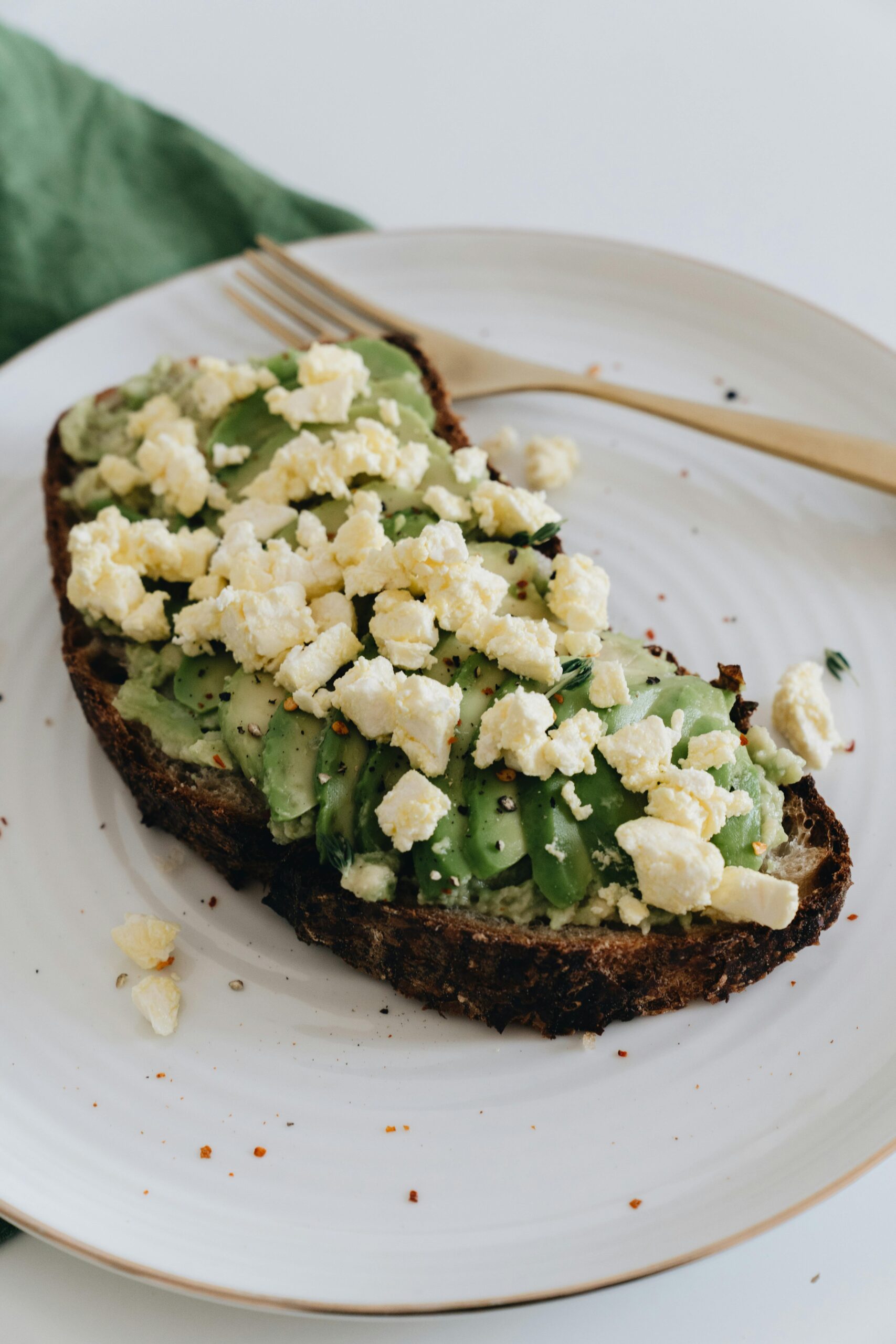 Farmers cheese crumbled on avocado toast showing DIY cheese and a simple cheese recipe
