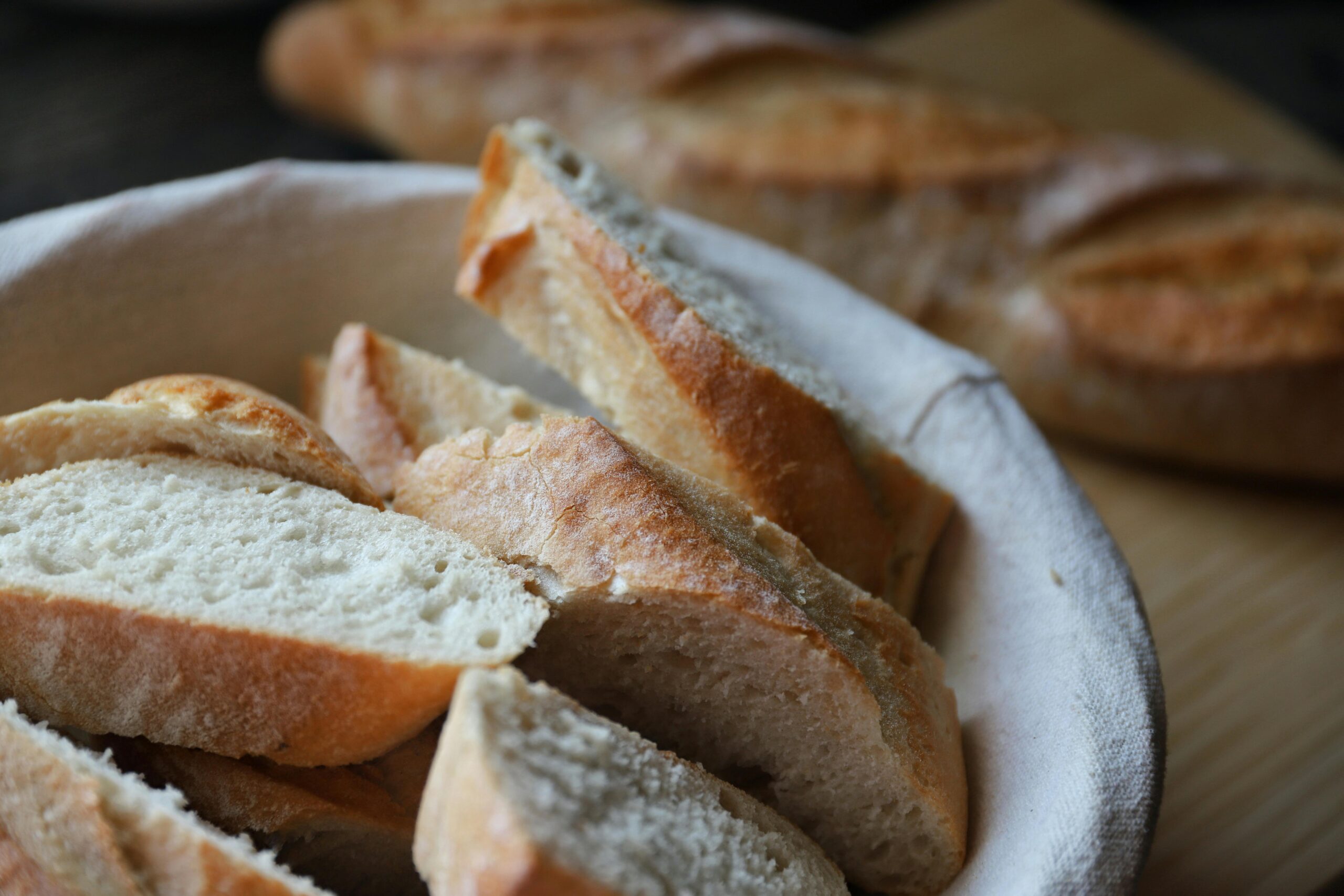 Artisan sourdough baguette cut into pieces, a homemade sourdough baguette recipe showing how to make sourdough baguettes