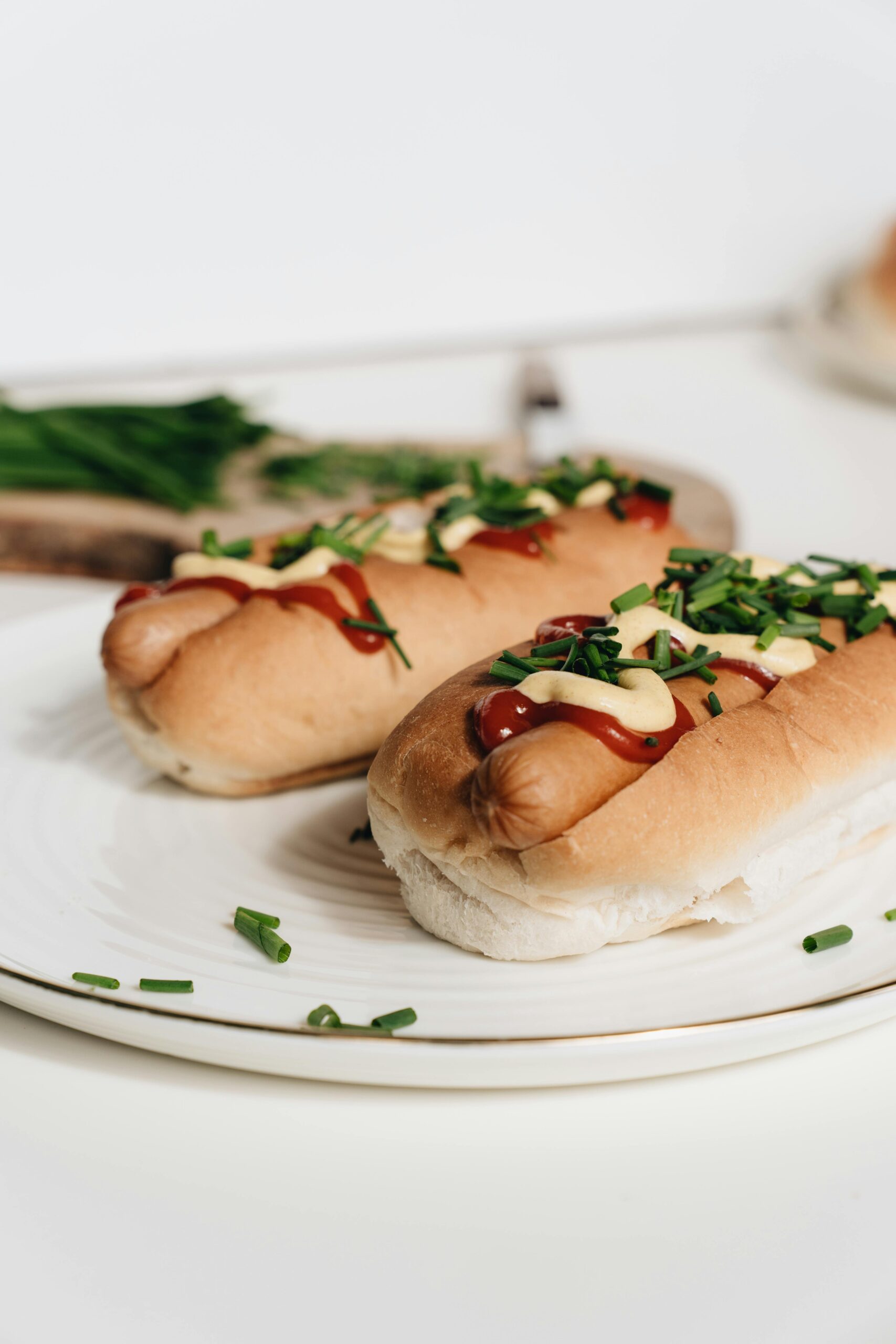Homemade hot dog buns with hot dogs for a soft sourdough hot dog bun recipe