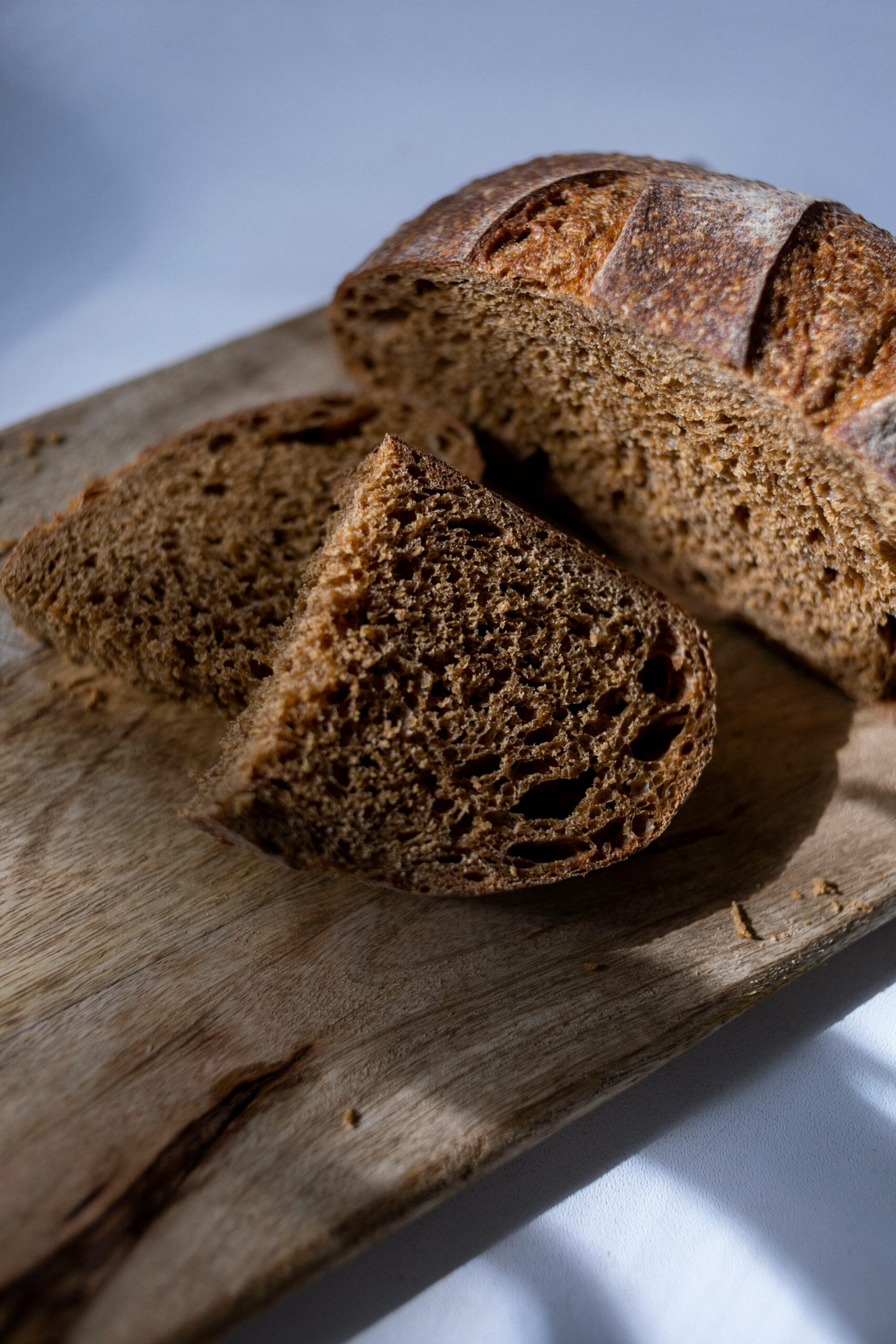 Cut homemade pumpernickel bread , a traditional pumpernickel bread recipe