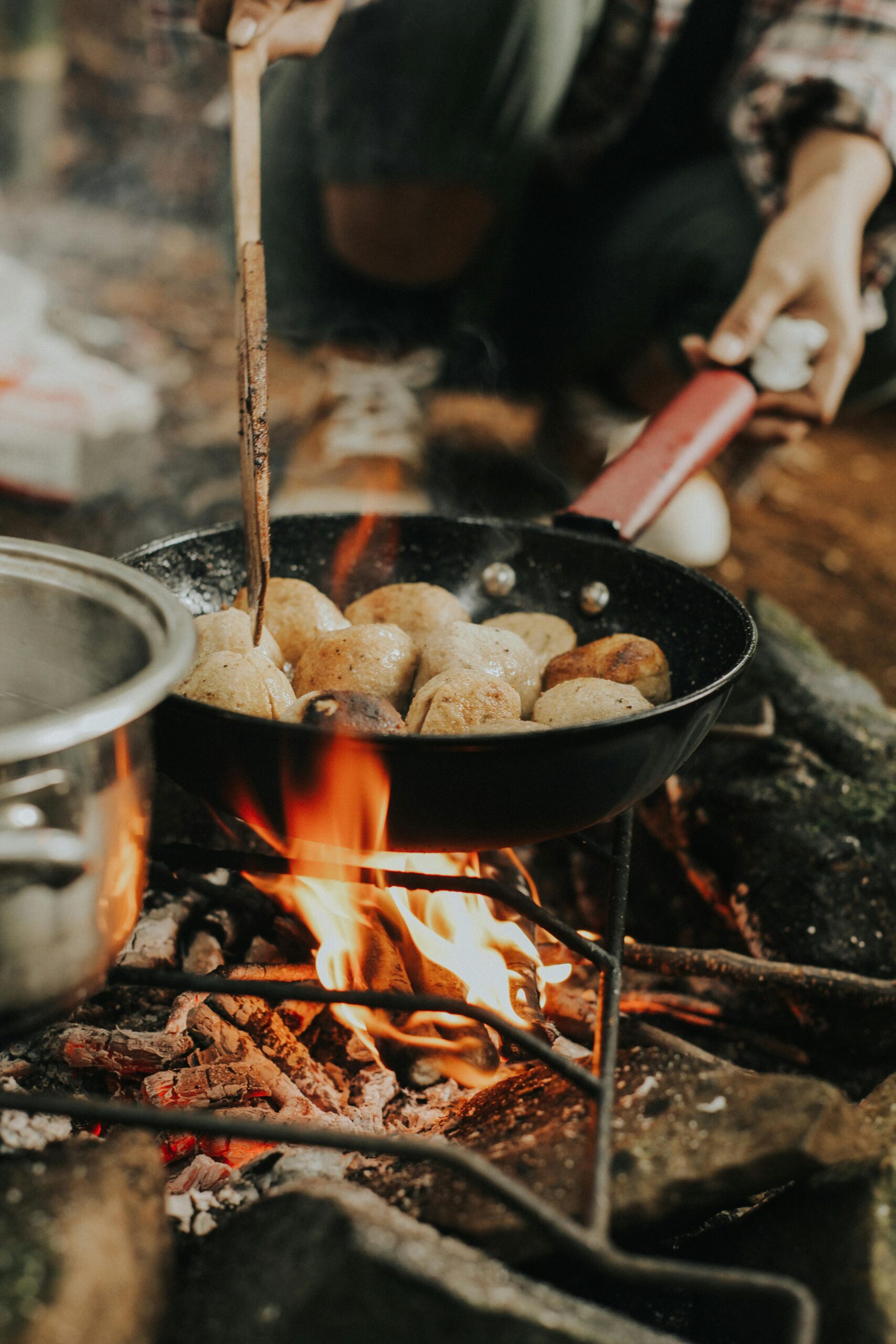 Cooking potatoes on a grill for off grid cooking meals and emergency food preparation
