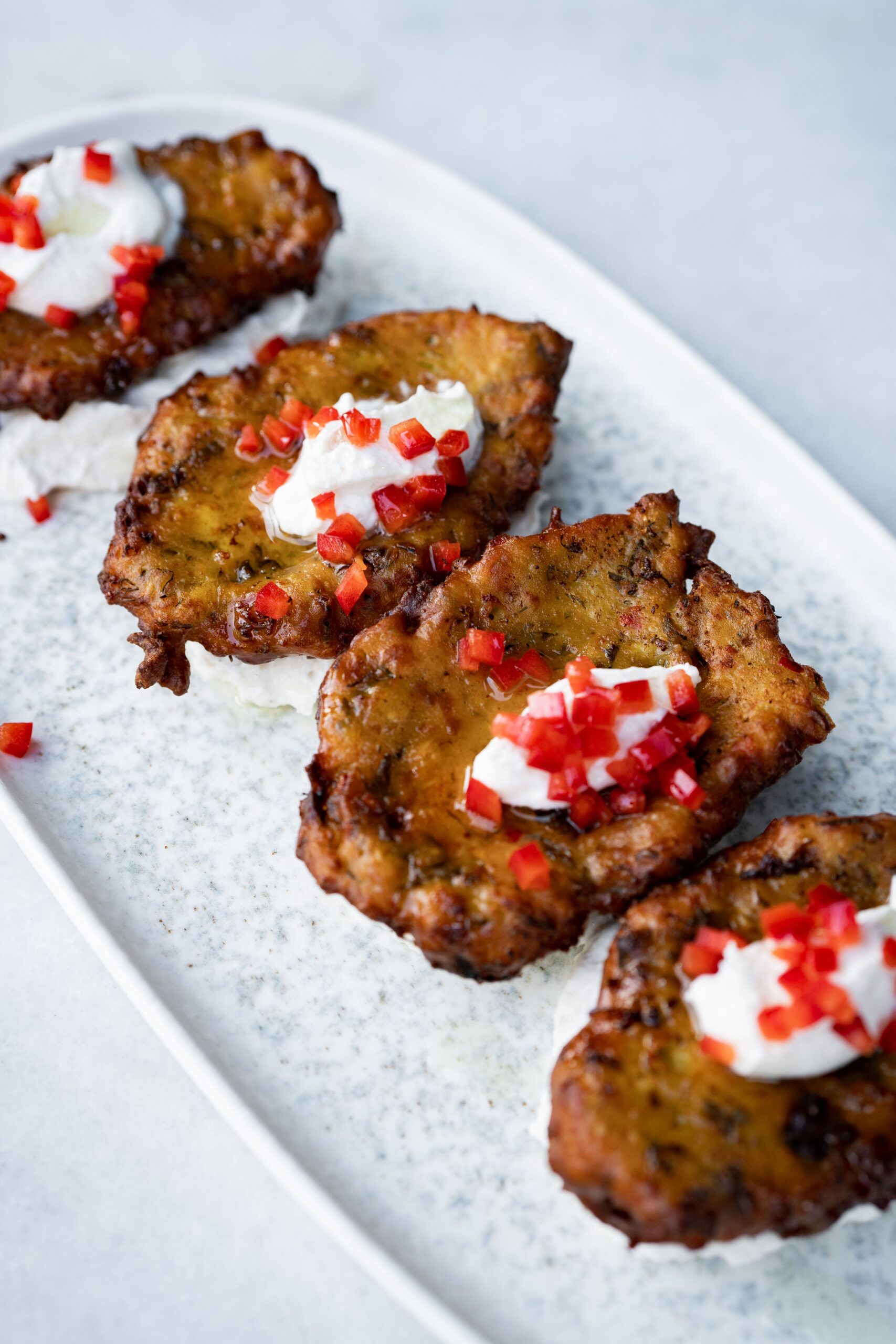easy garden zucchini recipes showing how to make zucchini fritters