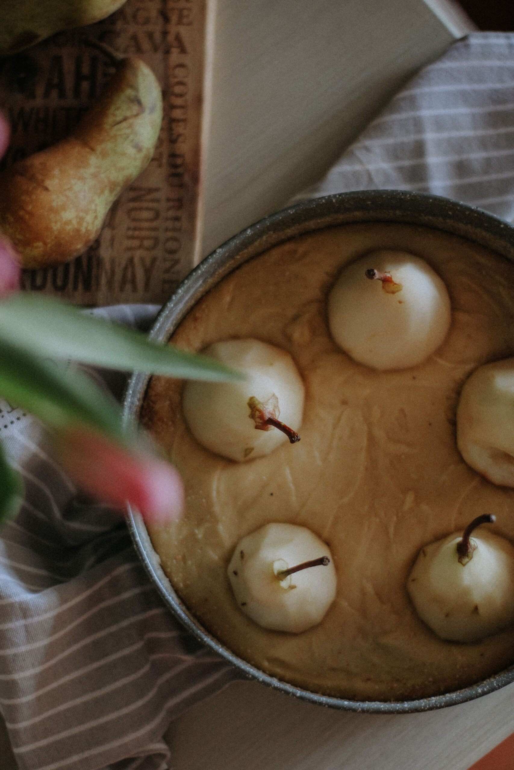 Unbaked  sourdough poached pear tart that is a rustic pear tart with sourdough crust